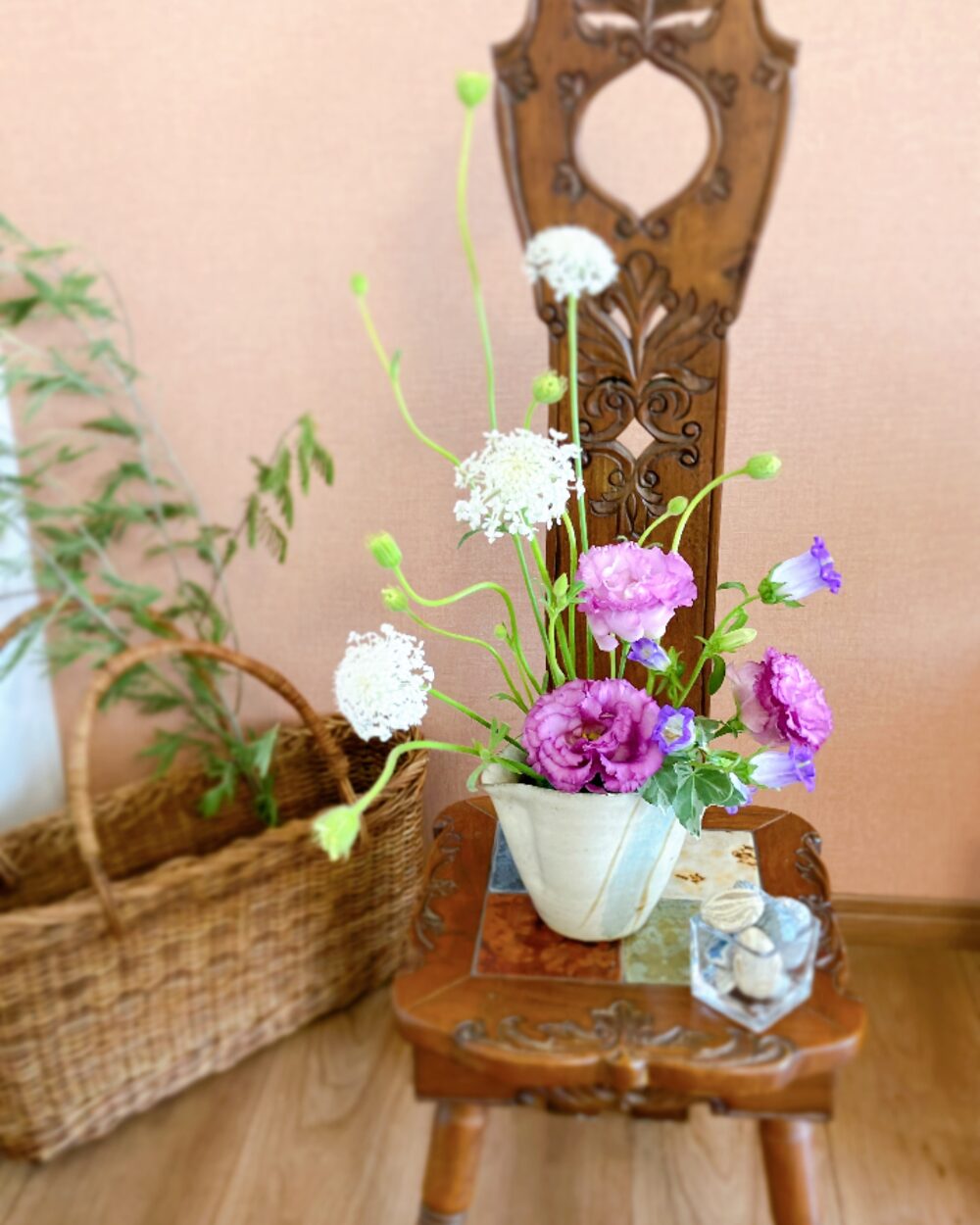 Detailed view of purple Lisianthus blossoms under the warm glow of an orange background