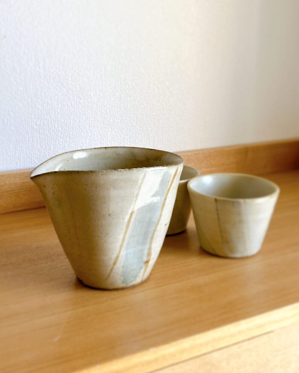 A minimalist grey-blue ceramic Japanese soba-tsuyu pitcher standing 11cm tall