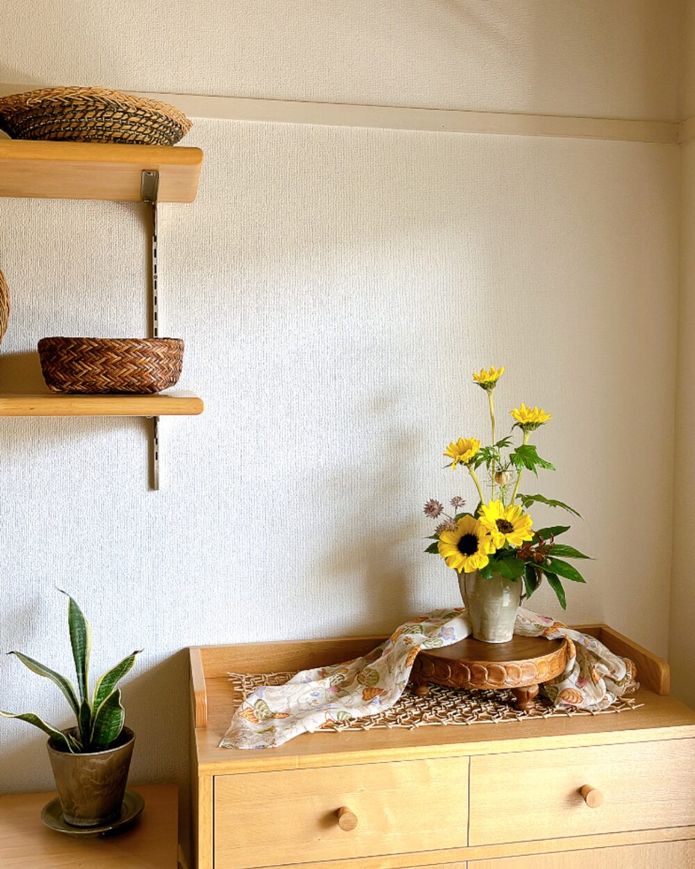 Wide shot of the sunflower arrangement capturing a corner of the shelf