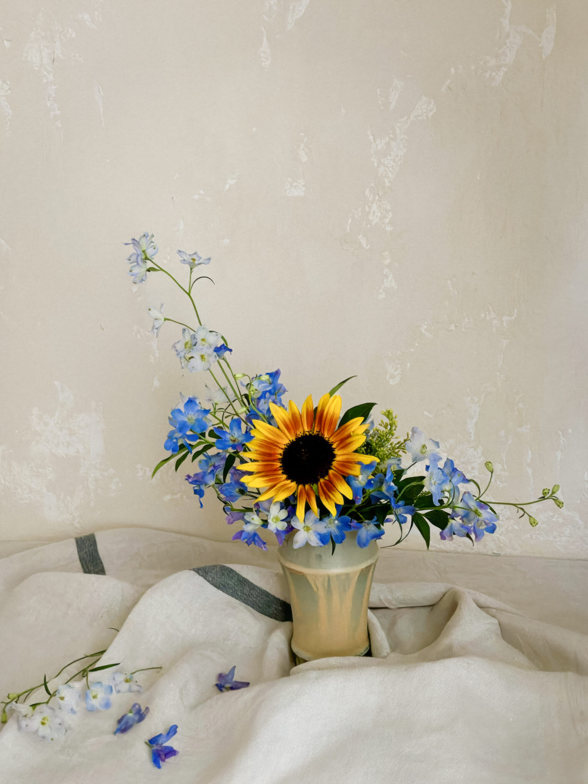 A fine-art photo preview of the abundant low sunflower and marigold dish captured dramatically against a dark background.